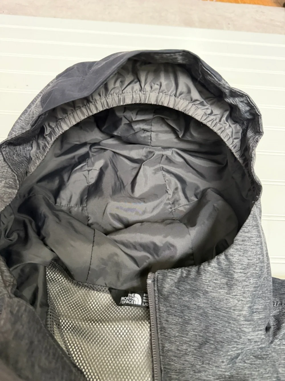 (172)The North Face Kids' Two-Tone Gray & Black Raincoat with Red Accents